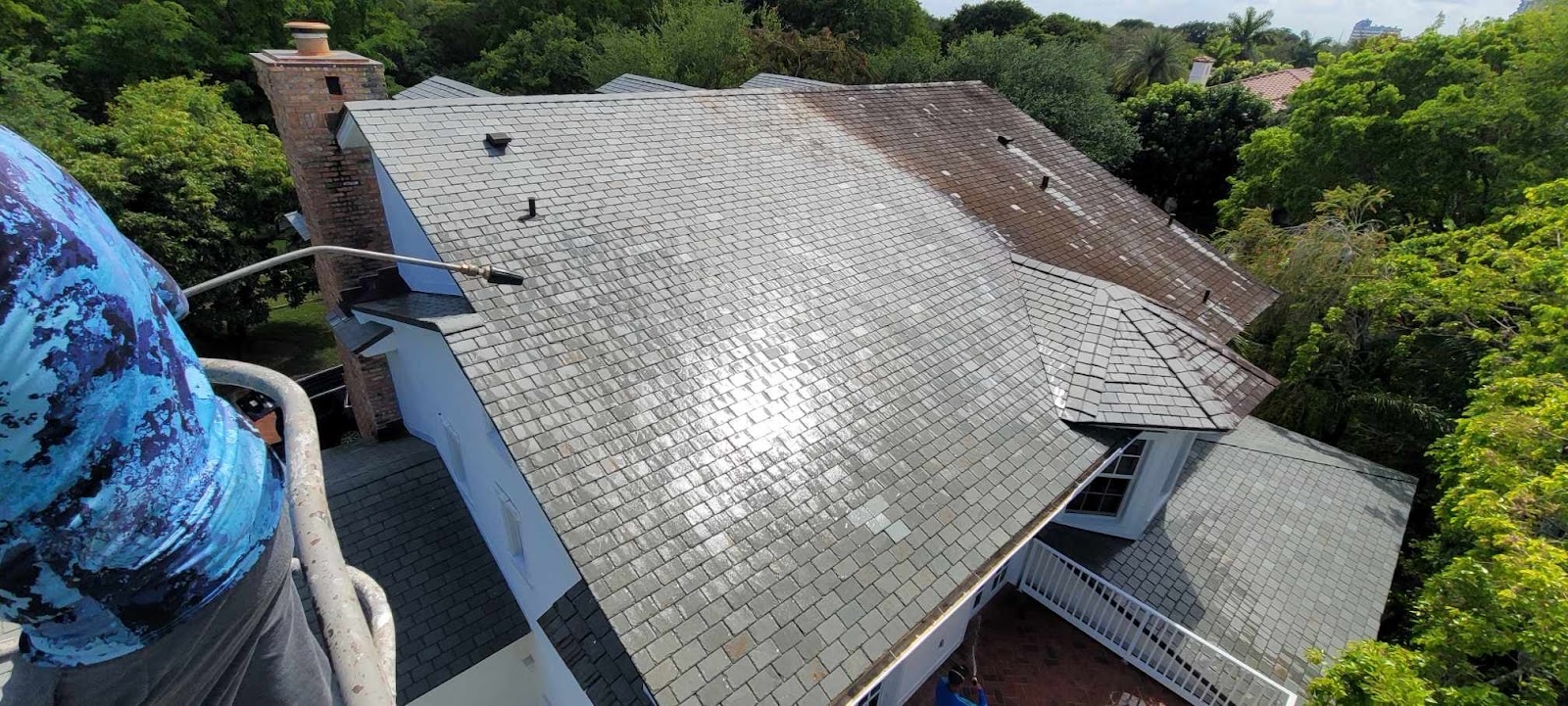 Miami roof with black algae streaks before cleaning
